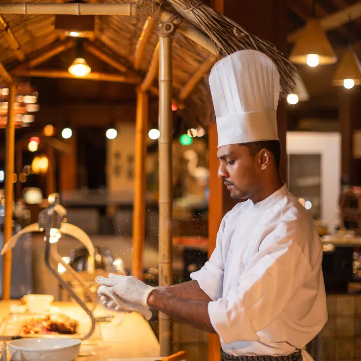A chef on a live station at Canareef Resort Maldives