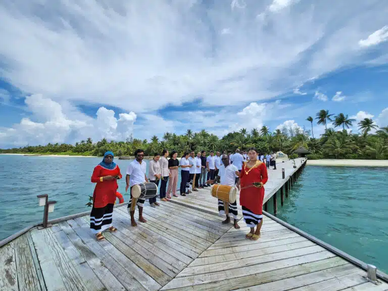 Guests on a wooden deck at Canareef Resort Maldives