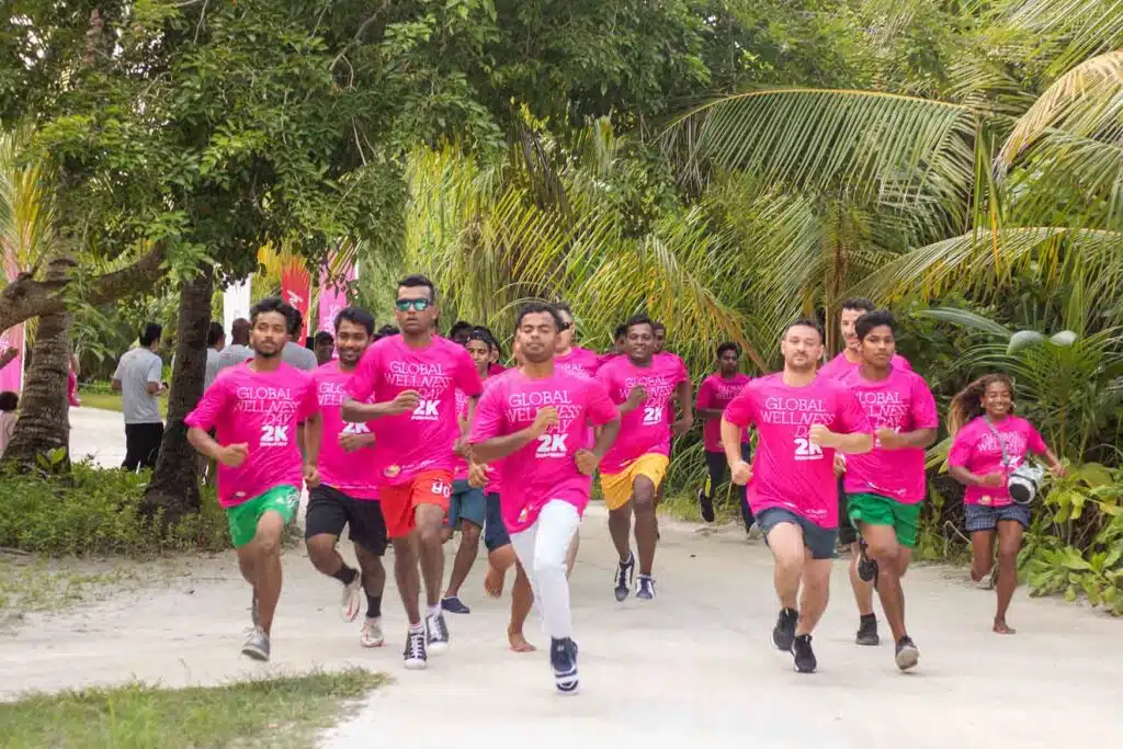 People running during an event at Canareef Resort Maldives