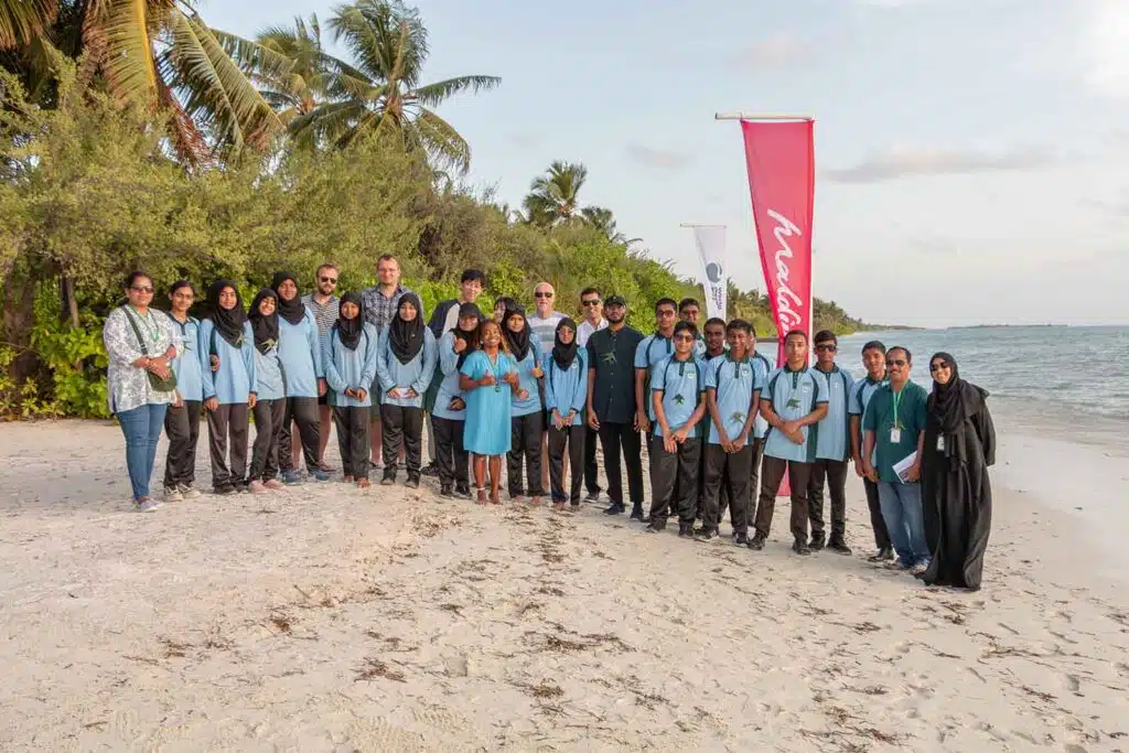 A group photo of guests at Canareef Resort Maldives