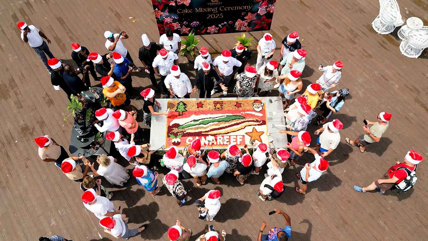 Guests mixing cake ingredients at Canareef Resort Maldives